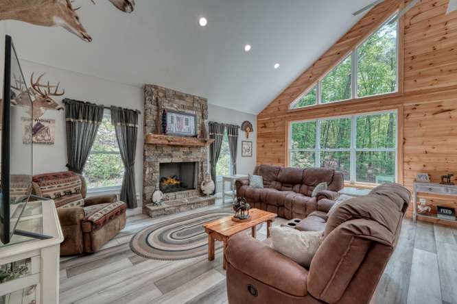 478 Flat Top Road Young Harris, GA 30582 - Photo 3 of 75 a living room with furniture and a fireplace