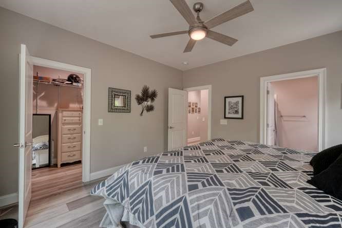 478 Flat Top Road Young Harris, GA 30582 - Photo 33 of 75 a bedroom with a large bed and a chandelier