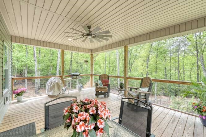 478 Flat Top Road Young Harris, GA 30582 - Photo 43 of 75 a living room filled with furniture and a large window