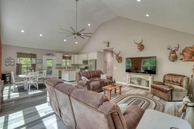 478 Flat Top Road Young Harris, GA 30582 - Photo 51 of 75 a living room with furniture kitchen view and a flat screen tv