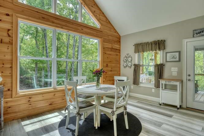 478 Flat Top Road Young Harris, GA 30582 - Photo 53 of 75 a view of a dining room with furniture window and wooden floor