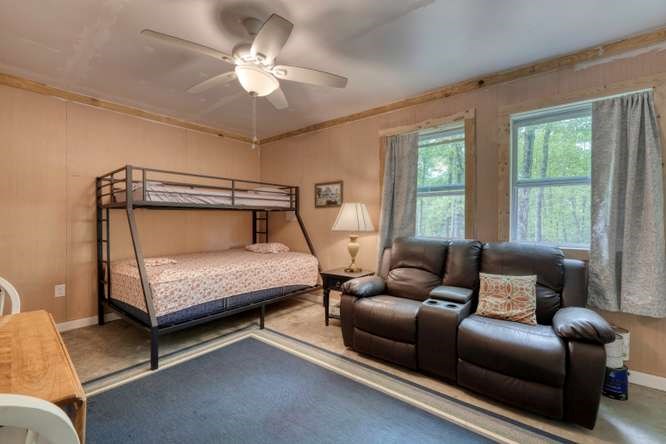 478 Flat Top Road Young Harris, GA 30582 - Photo 62 of 75 a bedroom with furniture and a window