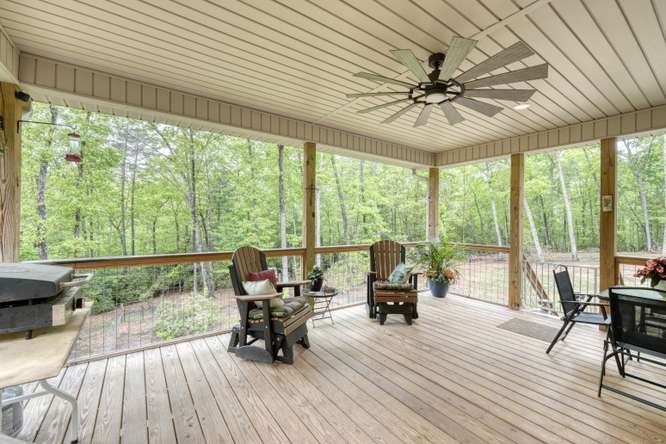 478 Flat Top Road Young Harris, GA 30582 - Photo 7 of 75 a living room with furniture and floor to ceiling windows