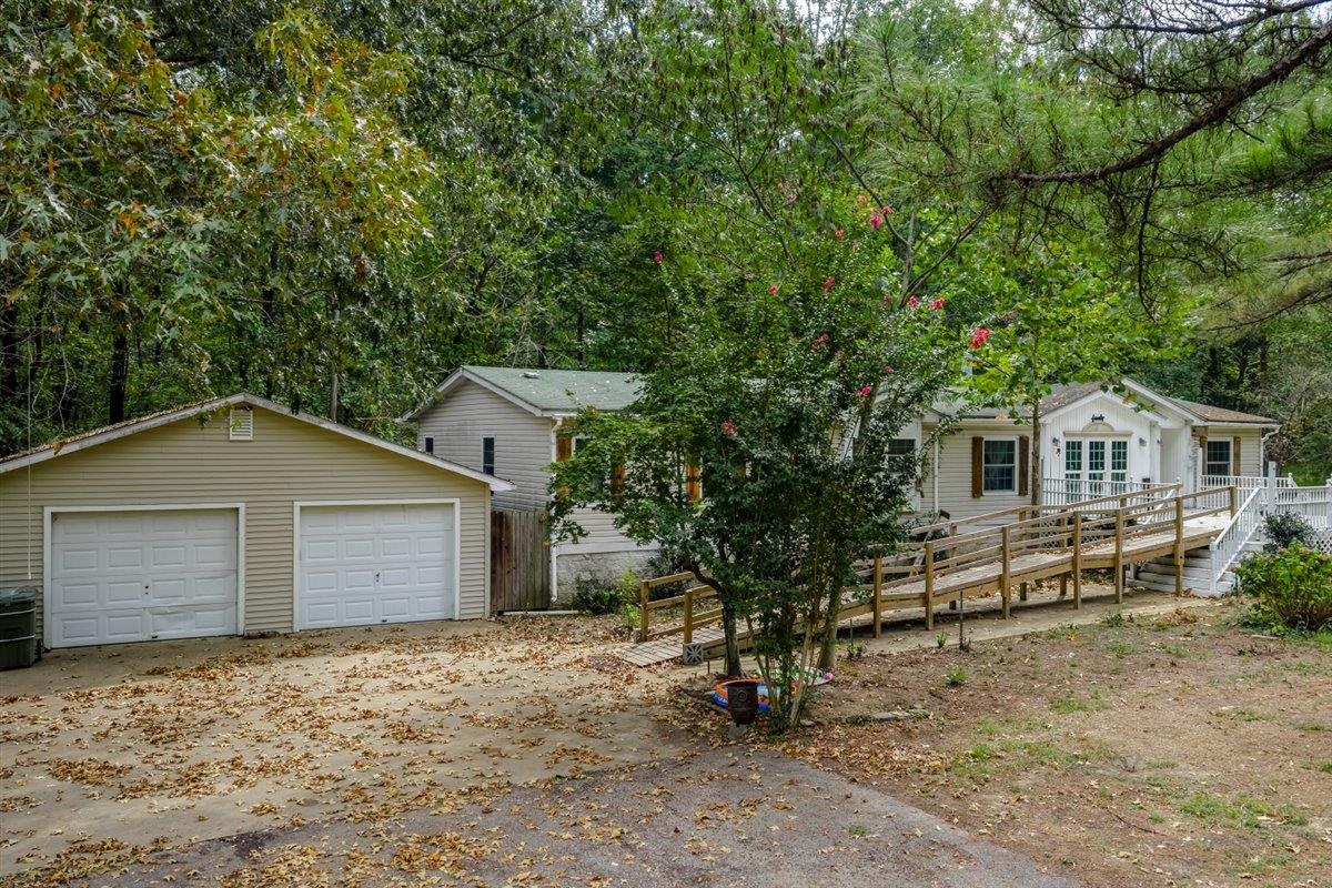 a house that has a tree in front of it