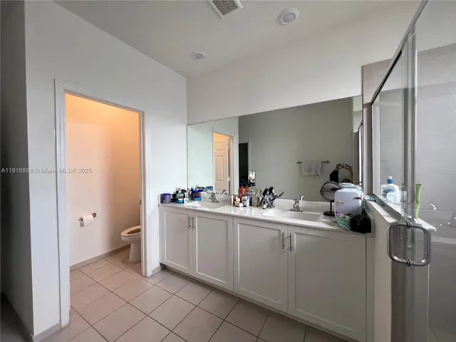 a room with a washing machine and sink