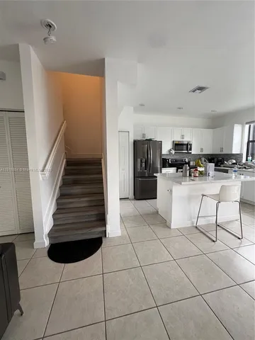 a kitchen with a cabinets and appliances