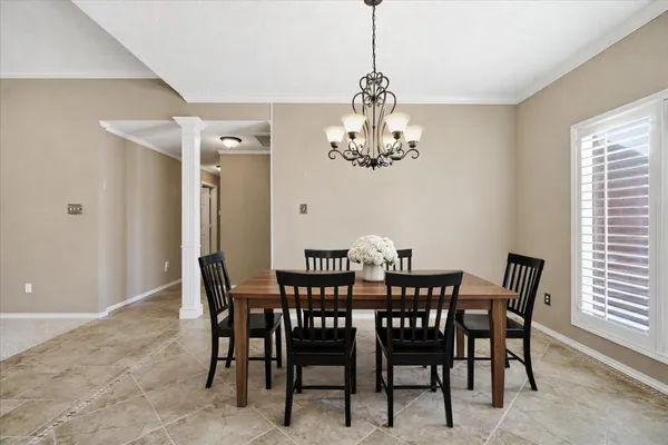 a kitchen with granite countertop white cabinets and sink