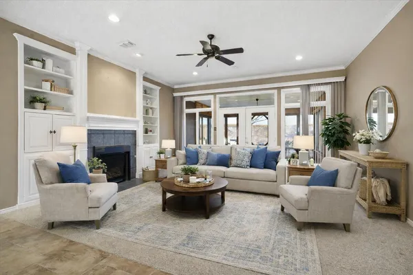 a view of a dining room with furniture and chandelier