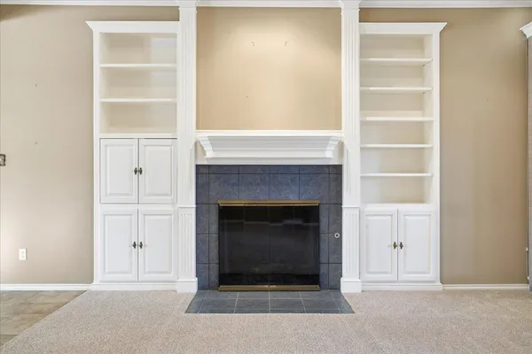 a kitchen with white cabinets and white appliances