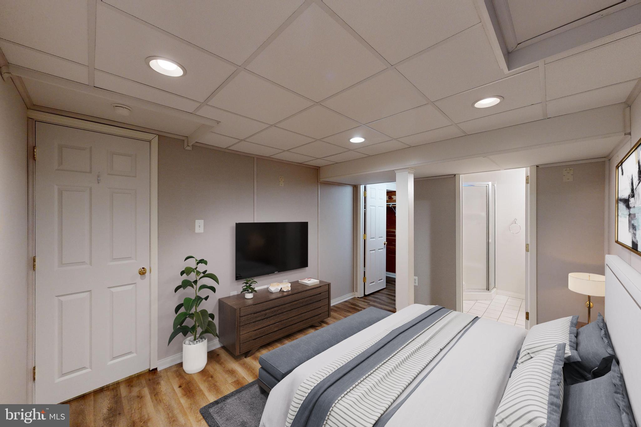 1101 White Oak Road Dover, DE 19901 - Photo 16 of 36 a bedroom with furniture and a flat screen tv