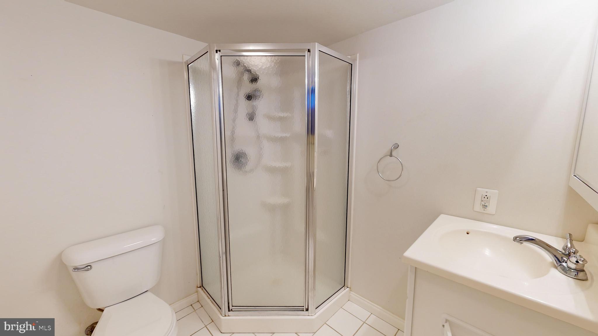 1101 White Oak Road Dover, DE 19901 - Photo 29 of 36 a white toilet sitting next to a bathroom sink