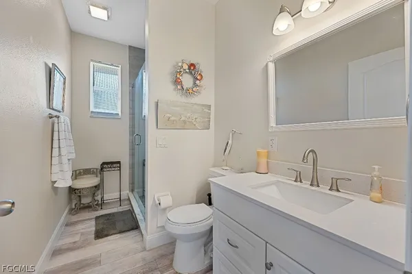 a bathroom with a sink toilet and vanity