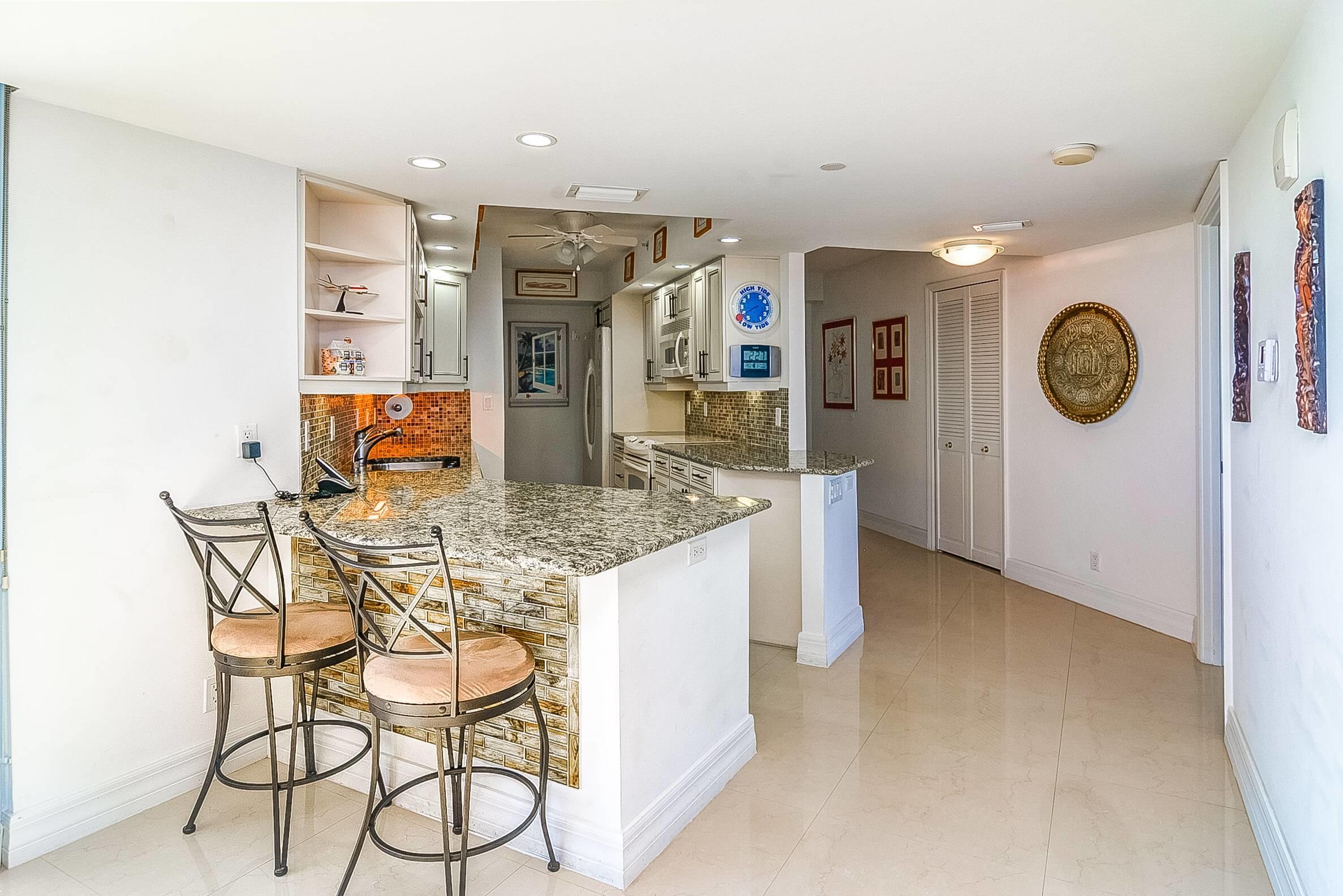 3000 North Ocean Drive, Unit PHF Riviera Beach, FL 33404 - Photo 10 of 43 Kitchen - Breakfast Bar