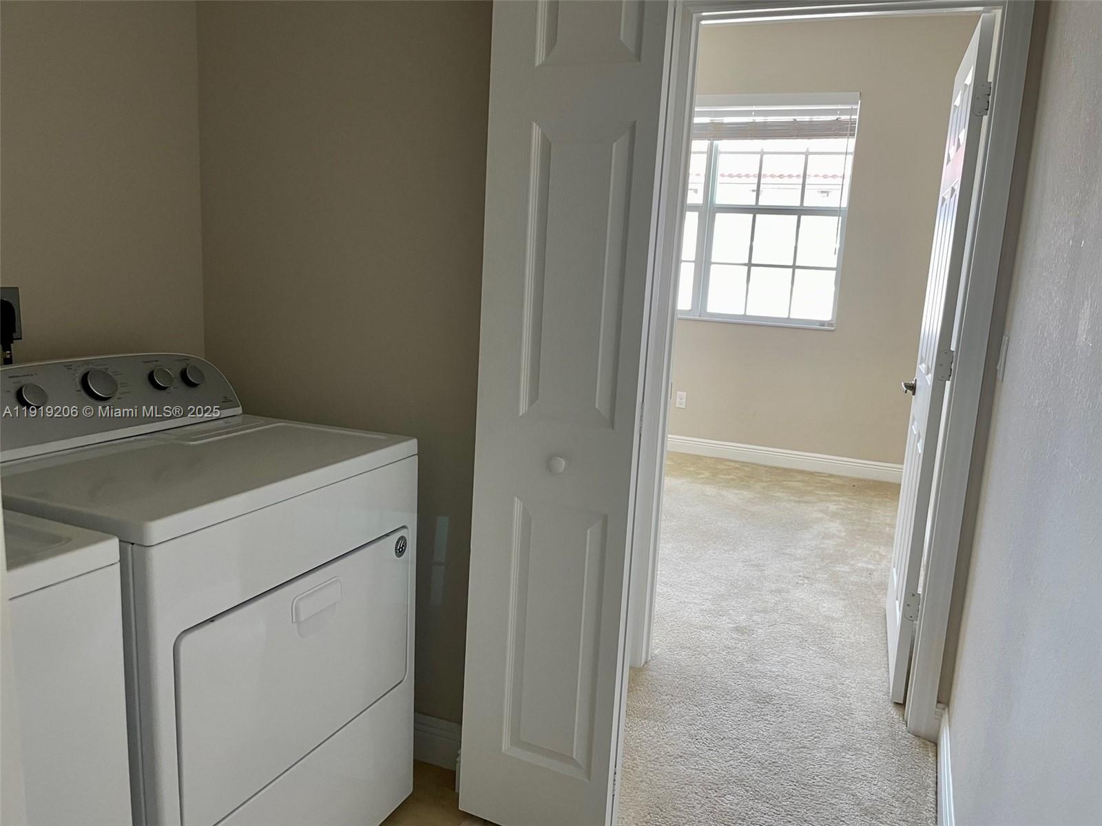 2929 Southwest 119th Way, Unit 2929 Miramar, FL 33025 - Photo 20 of 26 a utility room with dryer and washer