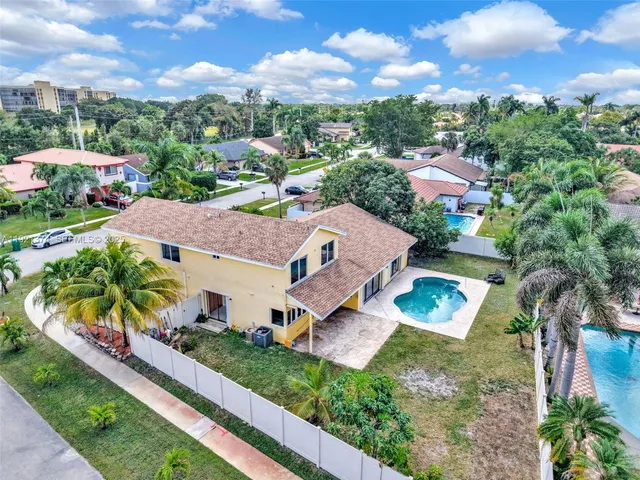 an aerial view of a house with a garden