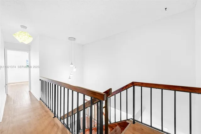 a spacious bedroom with a bed and a window