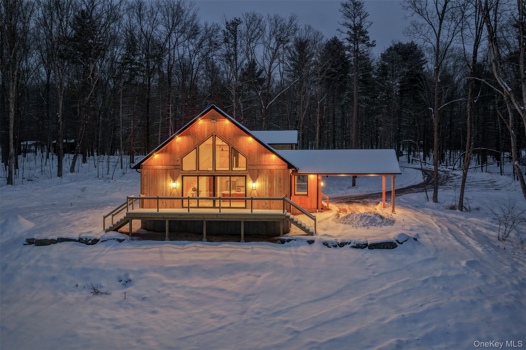 an outdoor space with swimming pool and furniture