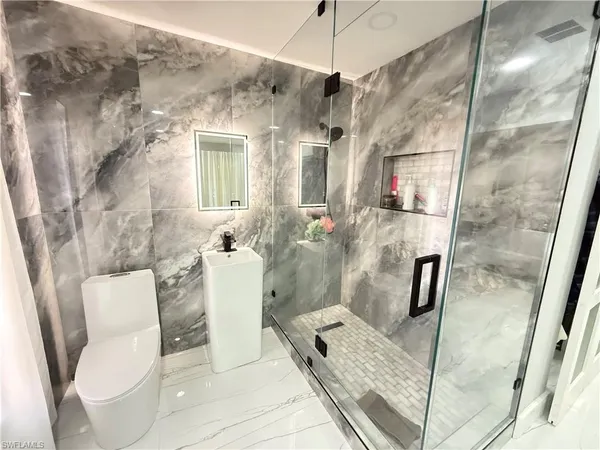 a bathroom with a sink and toilet