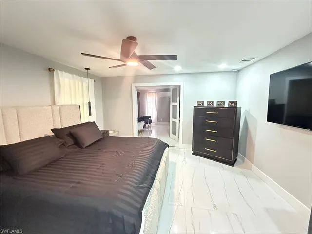 a bedroom with a bed and window