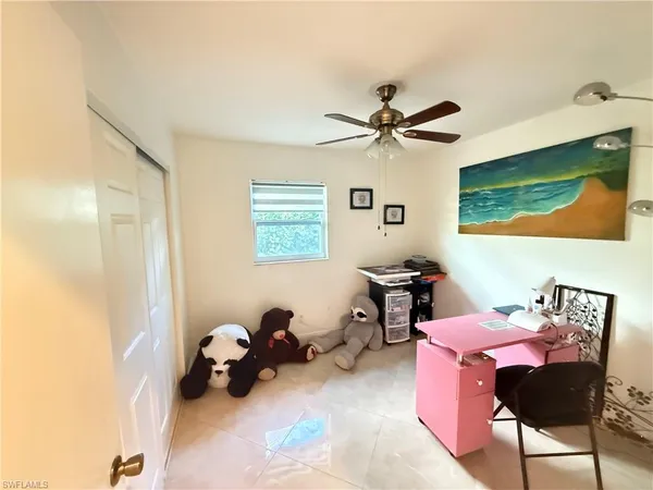 a bedroom with furniture and a window