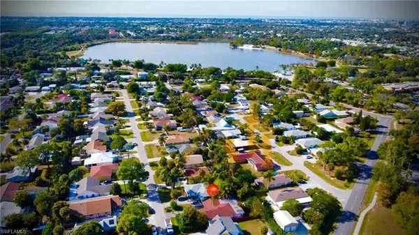 an aerial view of city and lake