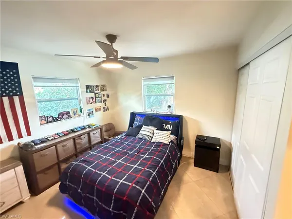 a bedroom with double bed and a window