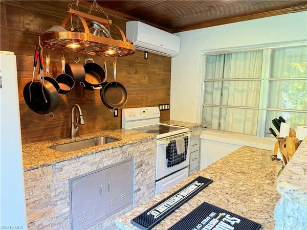 a kitchen with a stove and a sink