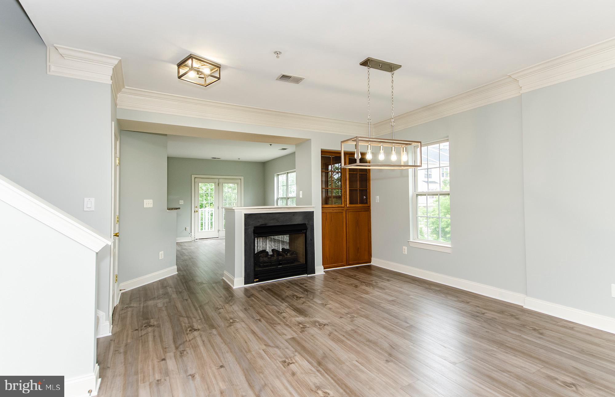 8069 Gatehouse Road, Unit 23 Falls Church, VA 22042 - Photo 15 of 45 Dining room w/ dual sided FP and built-ins