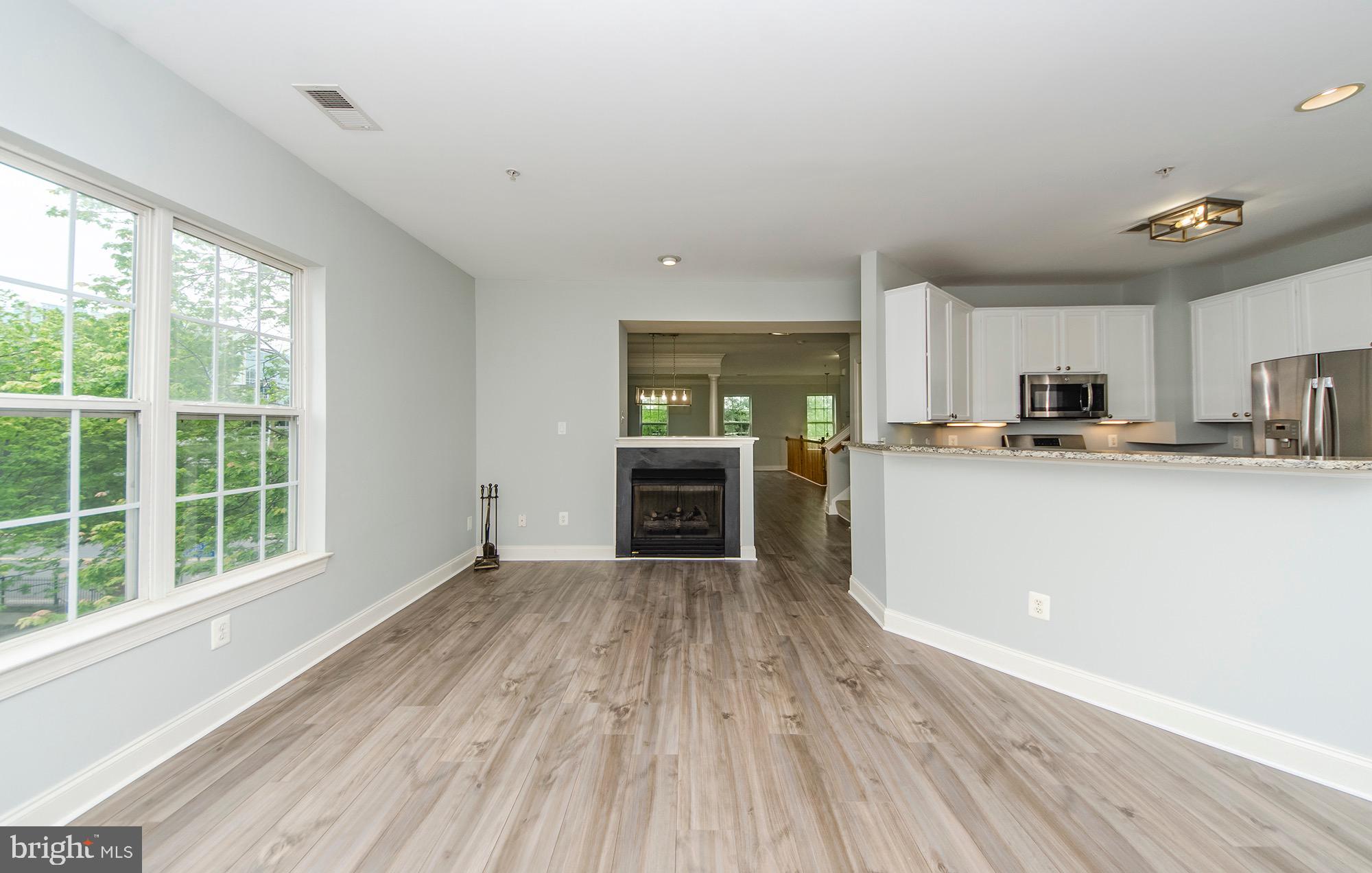 8069 Gatehouse Road, Unit 23 Falls Church, VA 22042 - Photo 18 of 45 Family room w/ dual sided FP