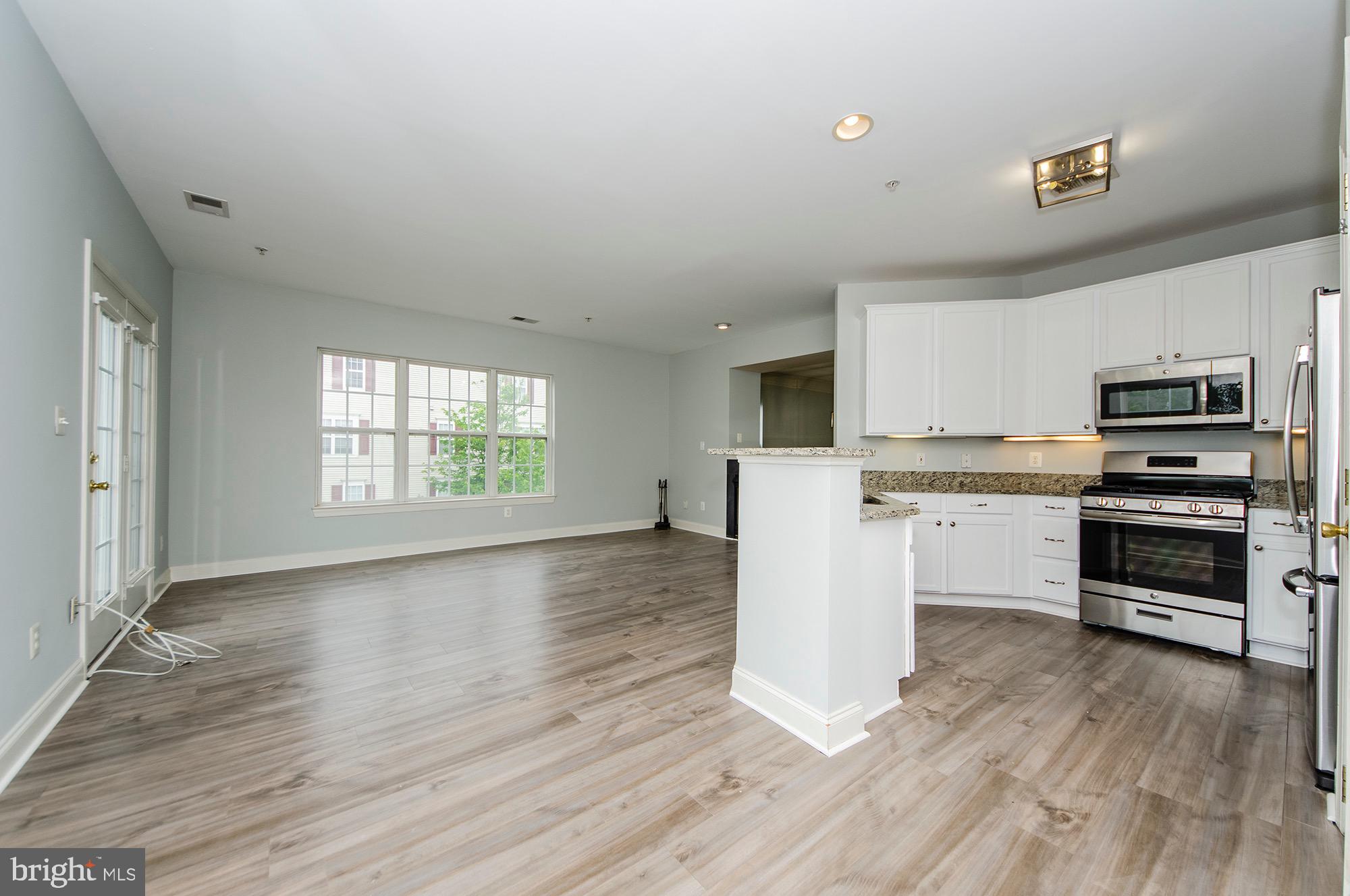 8069 Gatehouse Road, Unit 23 Falls Church, VA 22042 - Photo 19 of 45 Eat in area of kitchen looking into Fam Room