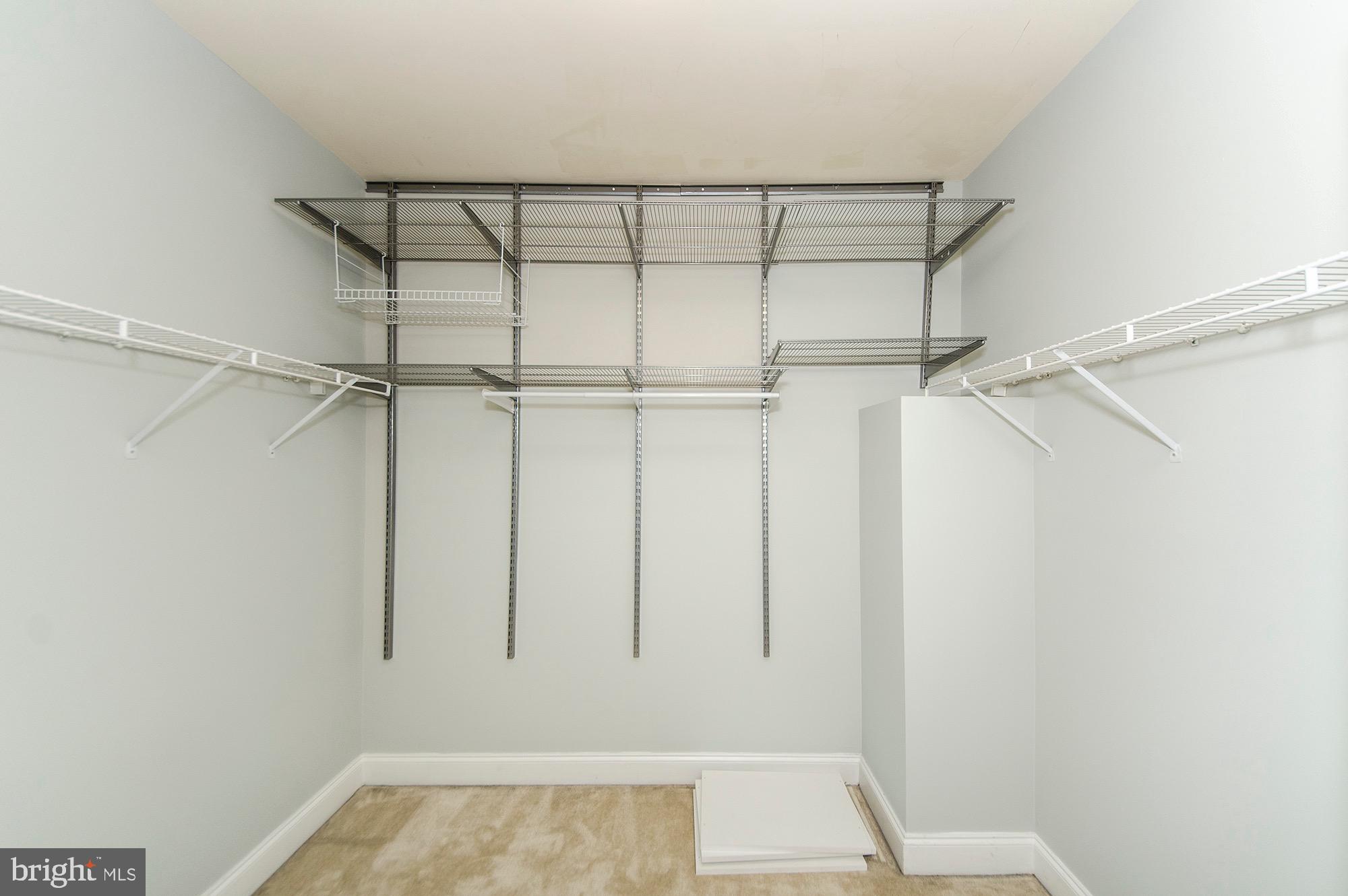 8069 Gatehouse Road, Unit 23 Falls Church, VA 22042 - Photo 39 of 45 Primary walk in closet w/ shelving