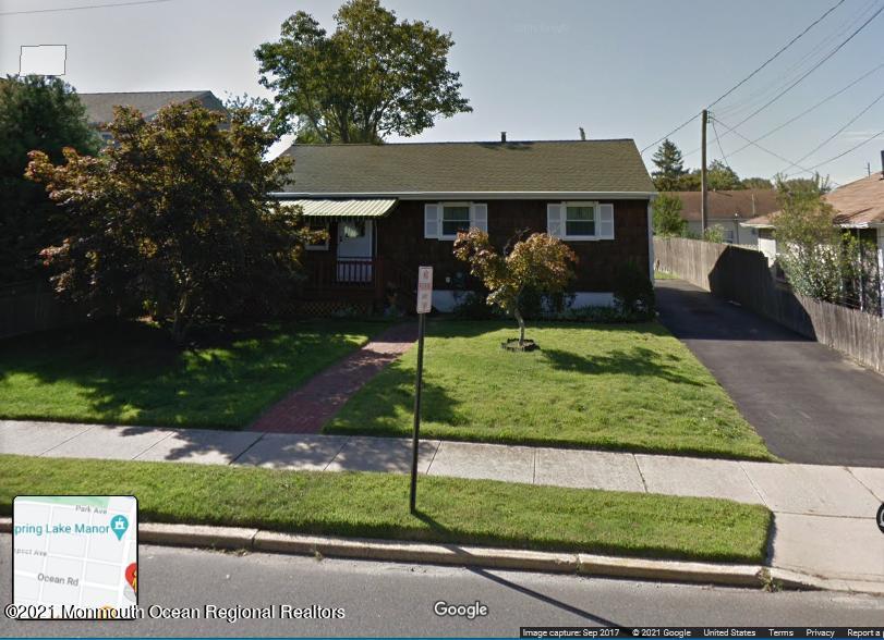 613 Ocean Road Spring Lake Heights, NJ 07762 - Photo 1 of 9 a front view of a house with a yard