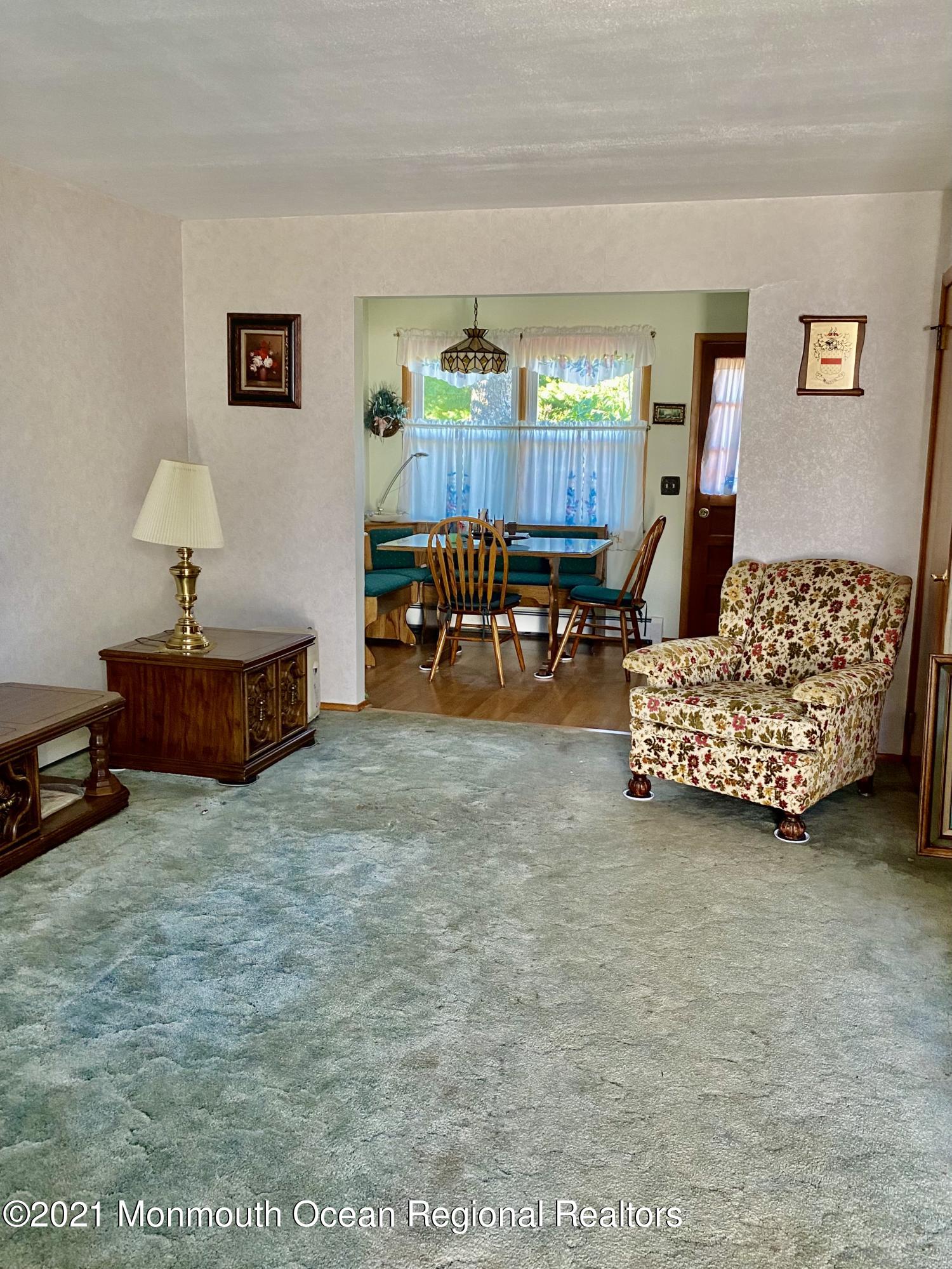 613 Ocean Road Spring Lake Heights, NJ 07762 - Photo 5 of 9 a bedroom with furniture and a window