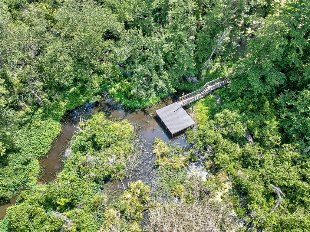 1901 Rose Pointe Athens, TX 75752 - Photo 33 of 37 Dock structure with a covered boat slip, accessed by a wooden walkway