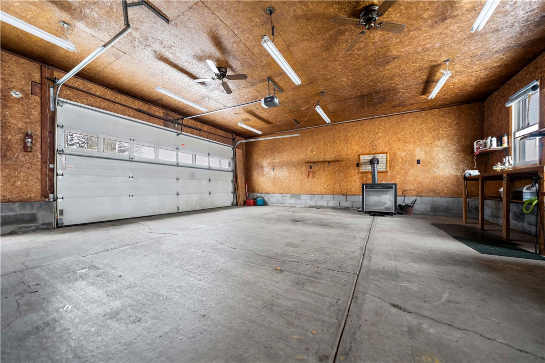 121 Cuddeback Road Phelps, NY 14532 - Photo 31 of 43 2 car garage w/ wood Stove- Storage