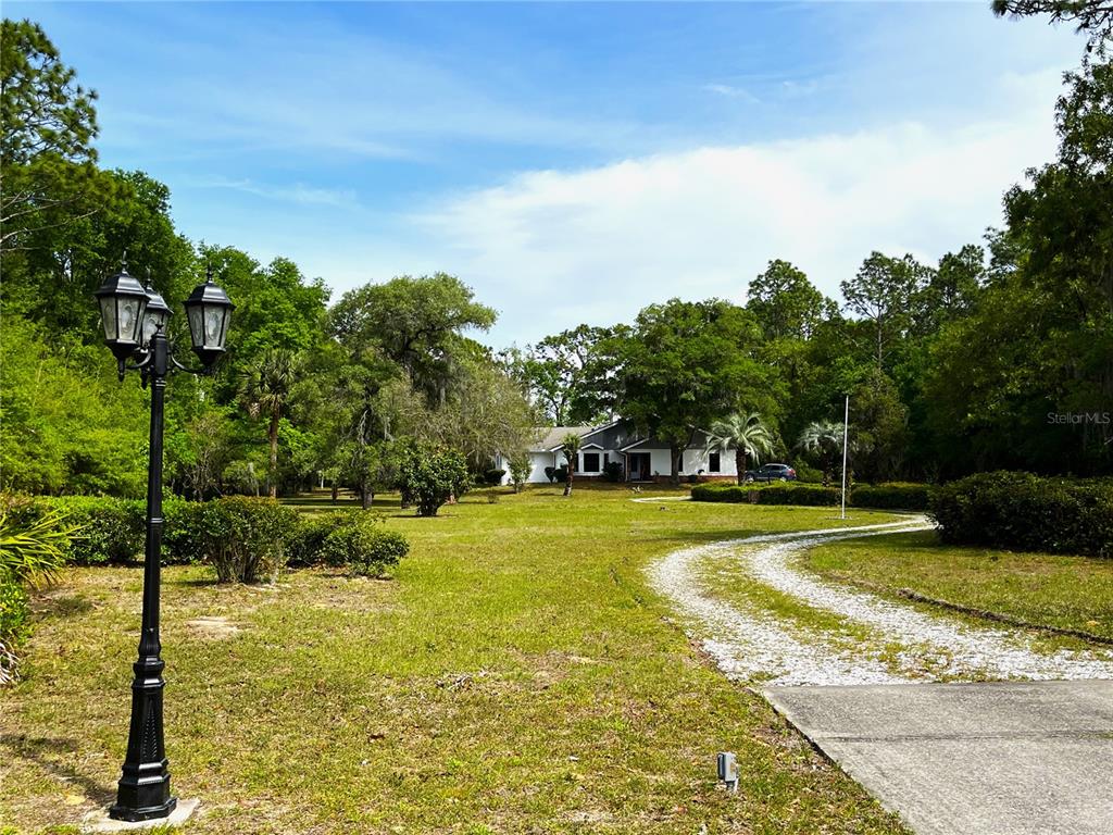 8531 Southwest 209th Ct Road Dunnellon, FL 34431 - Photo 1 of 1 From the road looking toward house