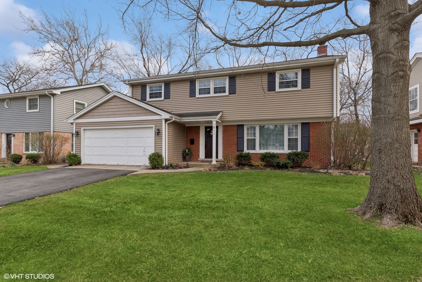 811 East Talbot Street Arlington Heights, IL 60004 - Photo 1 of 27 a front view of a house with a garden and yard