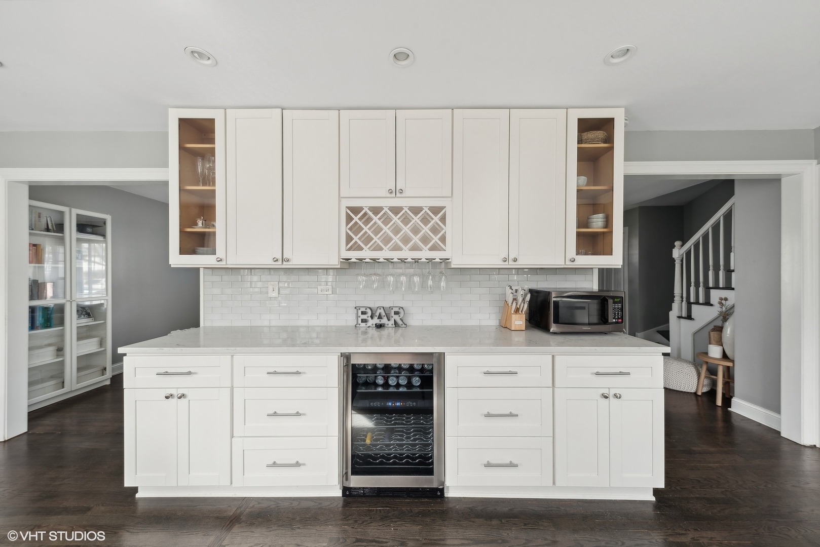 811 East Talbot Street Arlington Heights, IL 60004 - Photo 4 of 27 a kitchen with stainless steel appliances white cabinets and a wooden floor