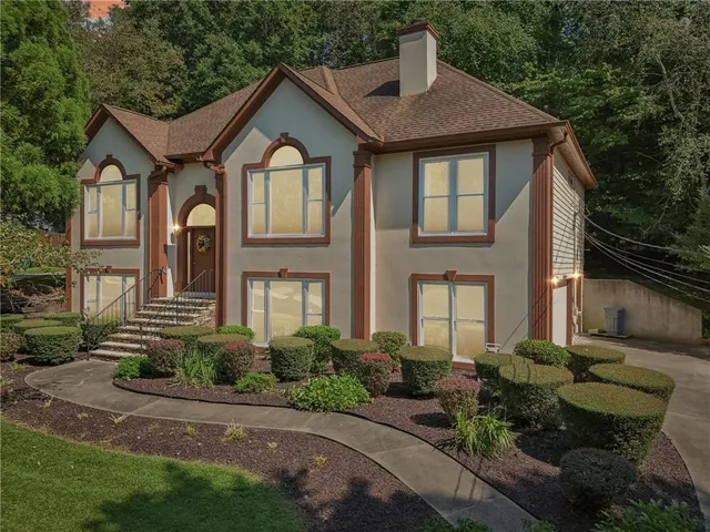 a view of house with a roof deck
