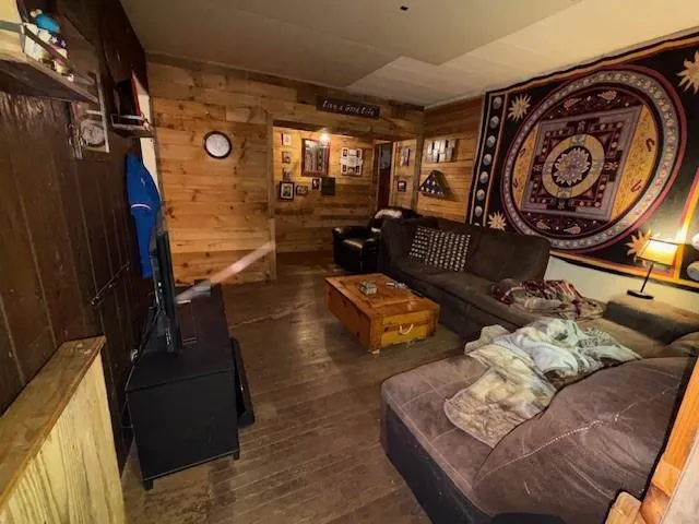 a view of livingroom with furniture and a floor to ceiling window