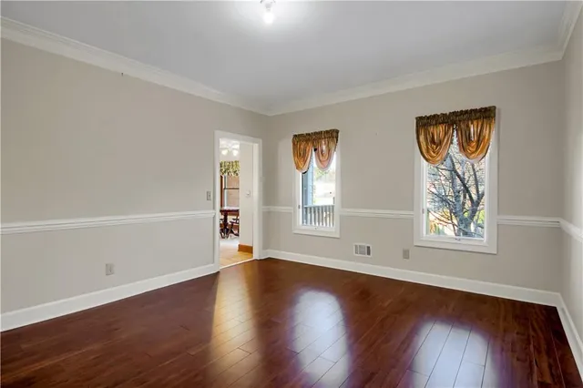 a bathroom with a granite countertop shower mirror and a sink