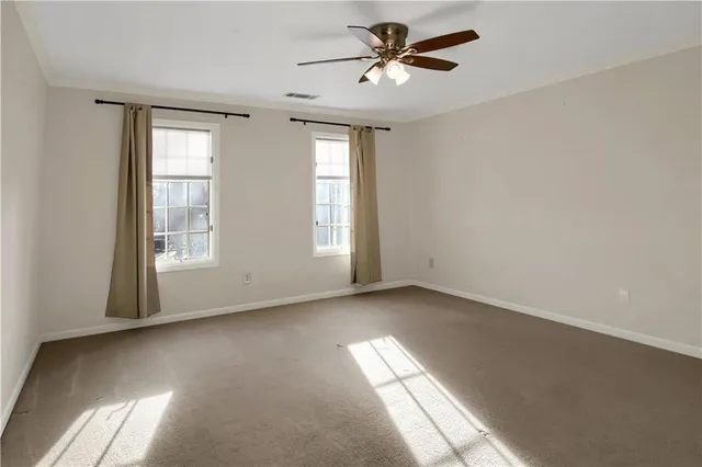 a dining room with furniture a chandelier and a rug