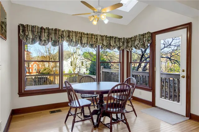 an empty room with closet and a ceiling fan