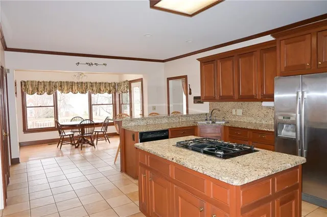 an empty room with windows and entrance