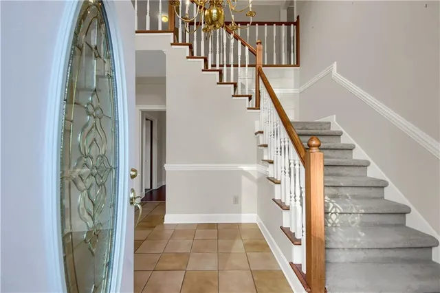 a view of empty room with wooden floor and window