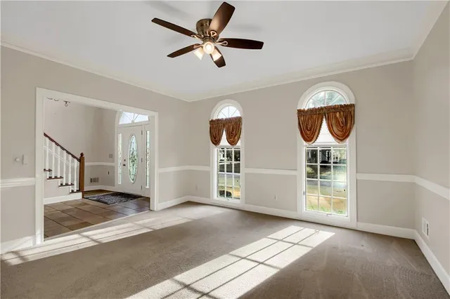 a bathroom with a granite countertop double vanity sink and a mirror