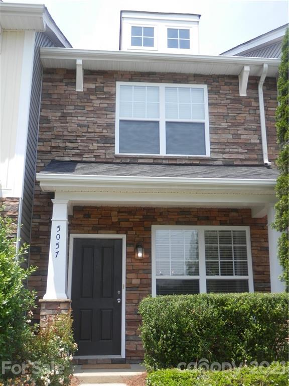 5057 Prosperity Church Road Charlotte, NC 28269 - Photo 1 of 24 a building with a window and a door