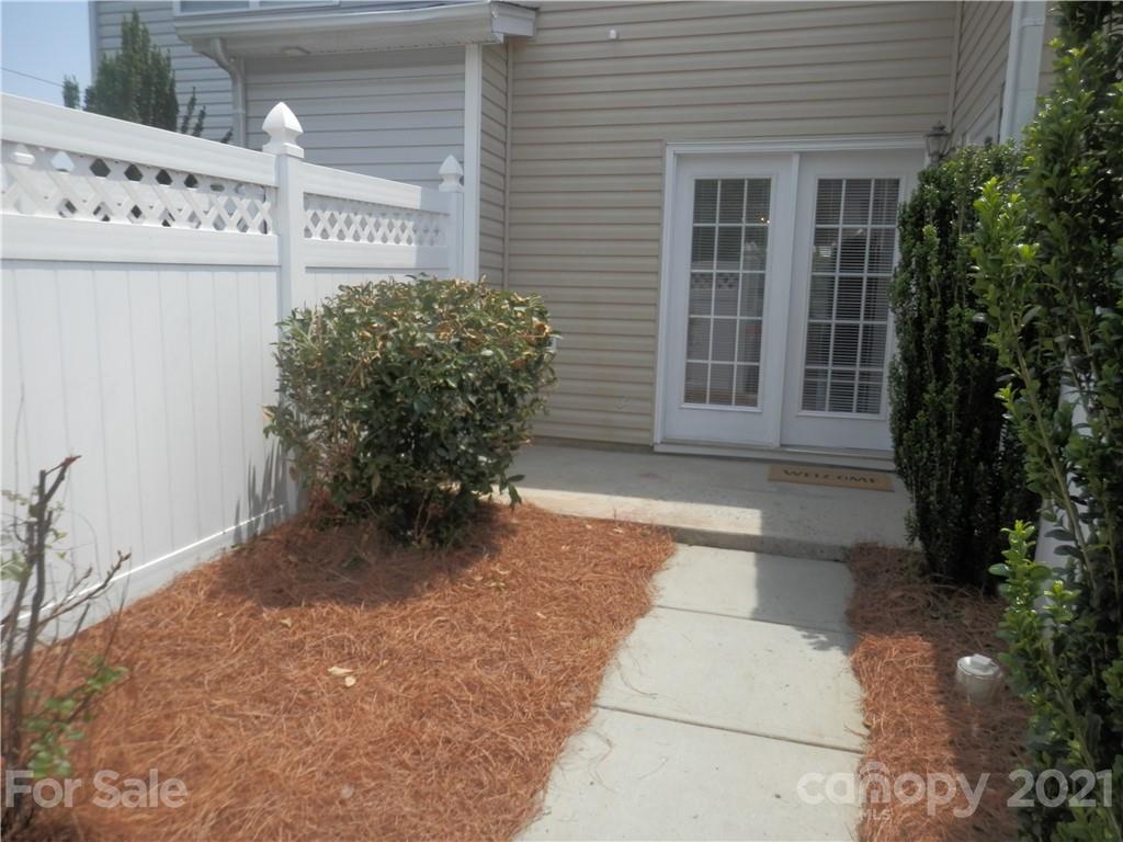 5057 Prosperity Church Road Charlotte, NC 28269 - Photo 16 of 24 a view of a entryway door front of house