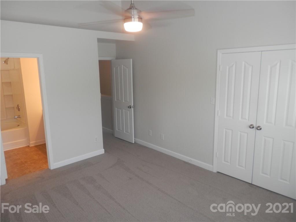 5057 Prosperity Church Road Charlotte, NC 28269 - Photo 17 of 24 a view of an empty room with a window