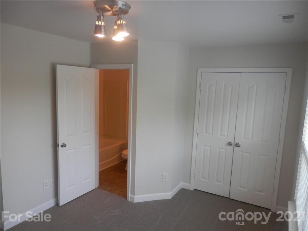 5057 Prosperity Church Road Charlotte, NC 28269 - Photo 21 of 24 wooden floor in an empty room